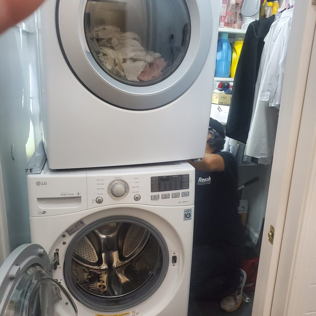 Stacked washer and dryer in closet